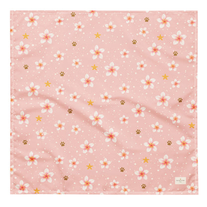 Aloha Paws dog bandana featuring pink plumeria flowers, paw prints, and golden stars on a blush pink background by HoneyPaw Pets.