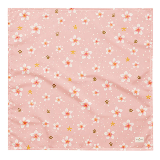 Aloha Paws dog bandana featuring pink plumeria flowers, paw prints, and golden stars on a blush pink background by HoneyPaw Pets.