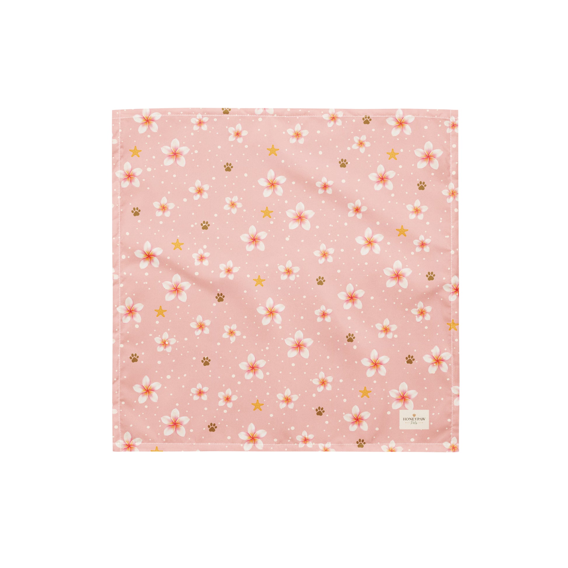 Aloha Paws dog bandana featuring pink plumeria flowers, paw prints, and golden stars on a blush pink background by HoneyPaw Pets.