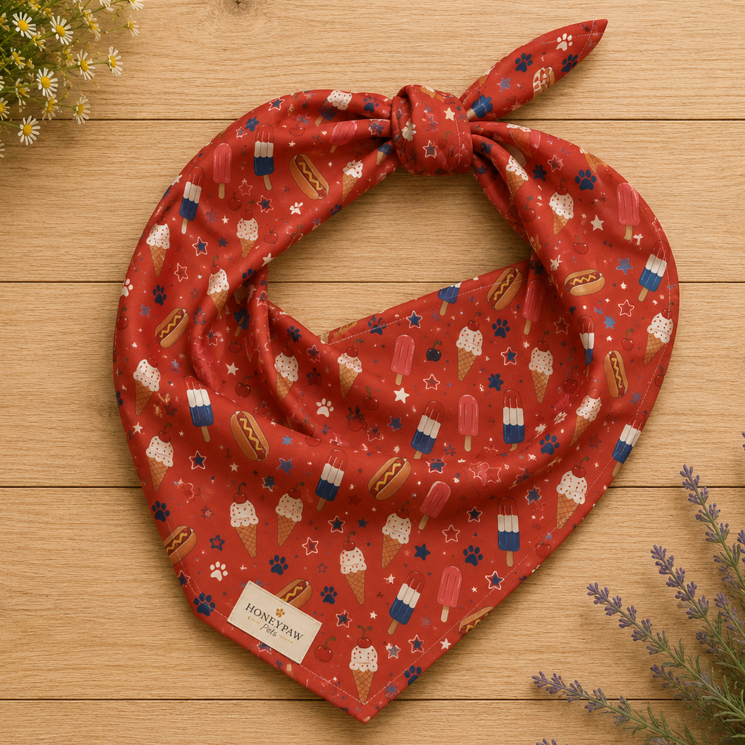 Backyard Bark-B-Q dog bandana featuring hot dogs, popsicles, and ice cream treats on a red background by HoneyPaw Pets.