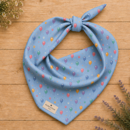 Balloon Bark Bash birthday dog bandana featuring colorful balloons and confetti on a light blue background by HoneyPaw Pets