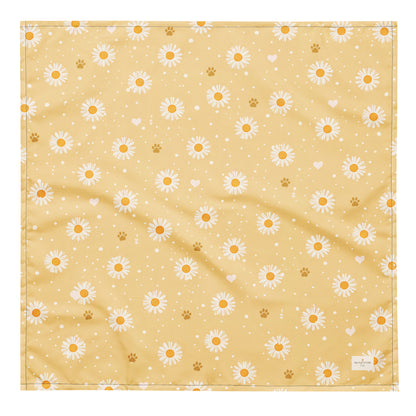 Butter Scout dog bandana featuring white daisy flowers, golden paw prints, and tiny hearts on a buttery yellow background by HoneyPaw Pets.