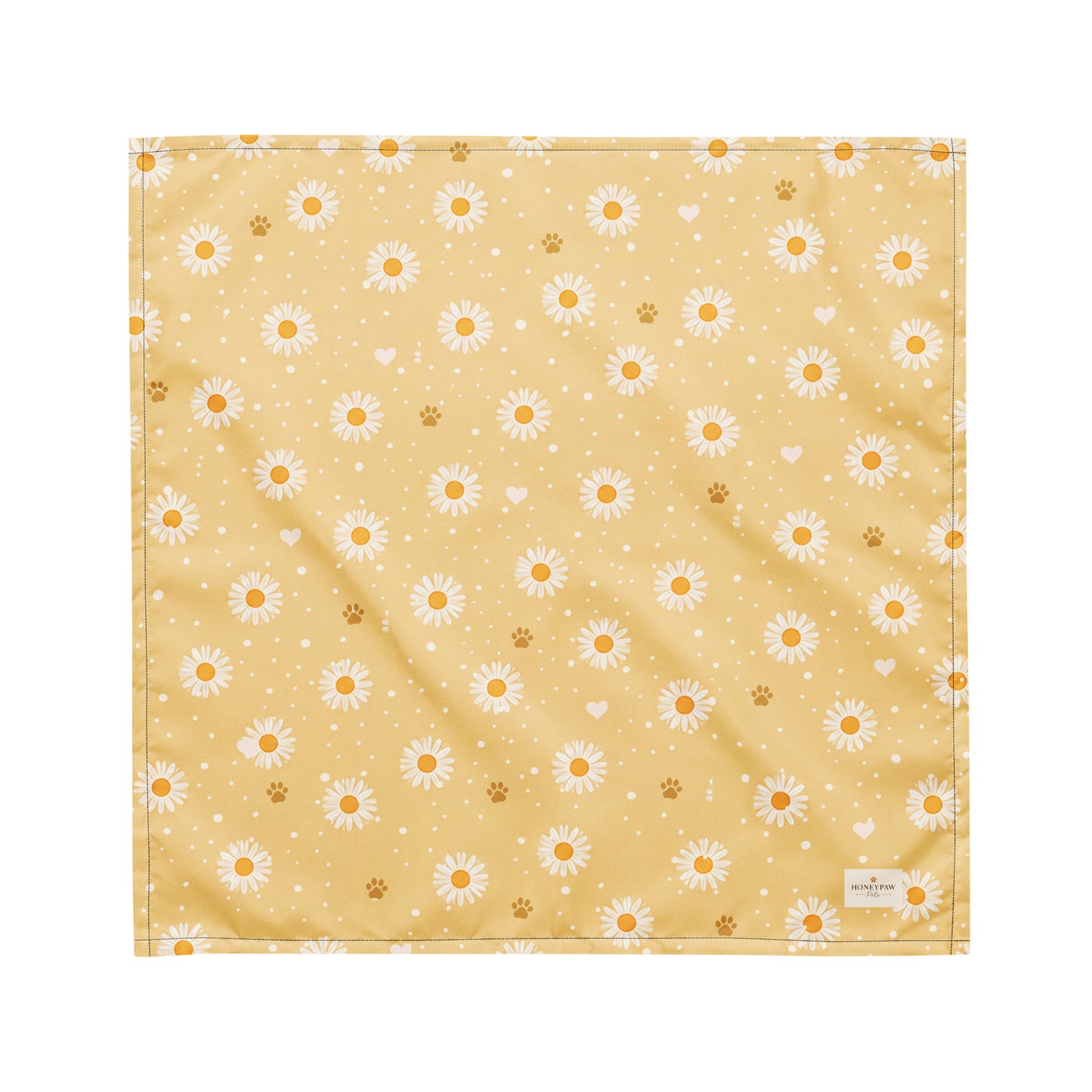 Butter Scout dog bandana featuring white daisy flowers, golden paw prints, and tiny hearts on a buttery yellow background by HoneyPaw Pets.
