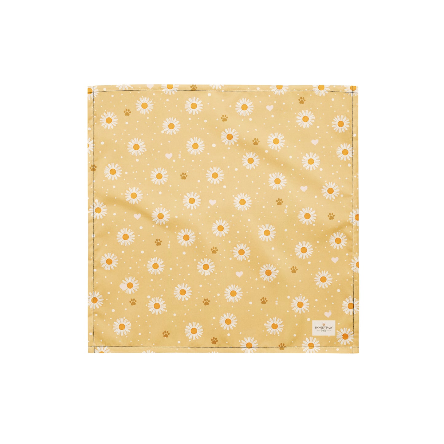 Butter Scout dog bandana featuring white daisy flowers, golden paw prints, and tiny hearts on a buttery yellow background by HoneyPaw Pets.