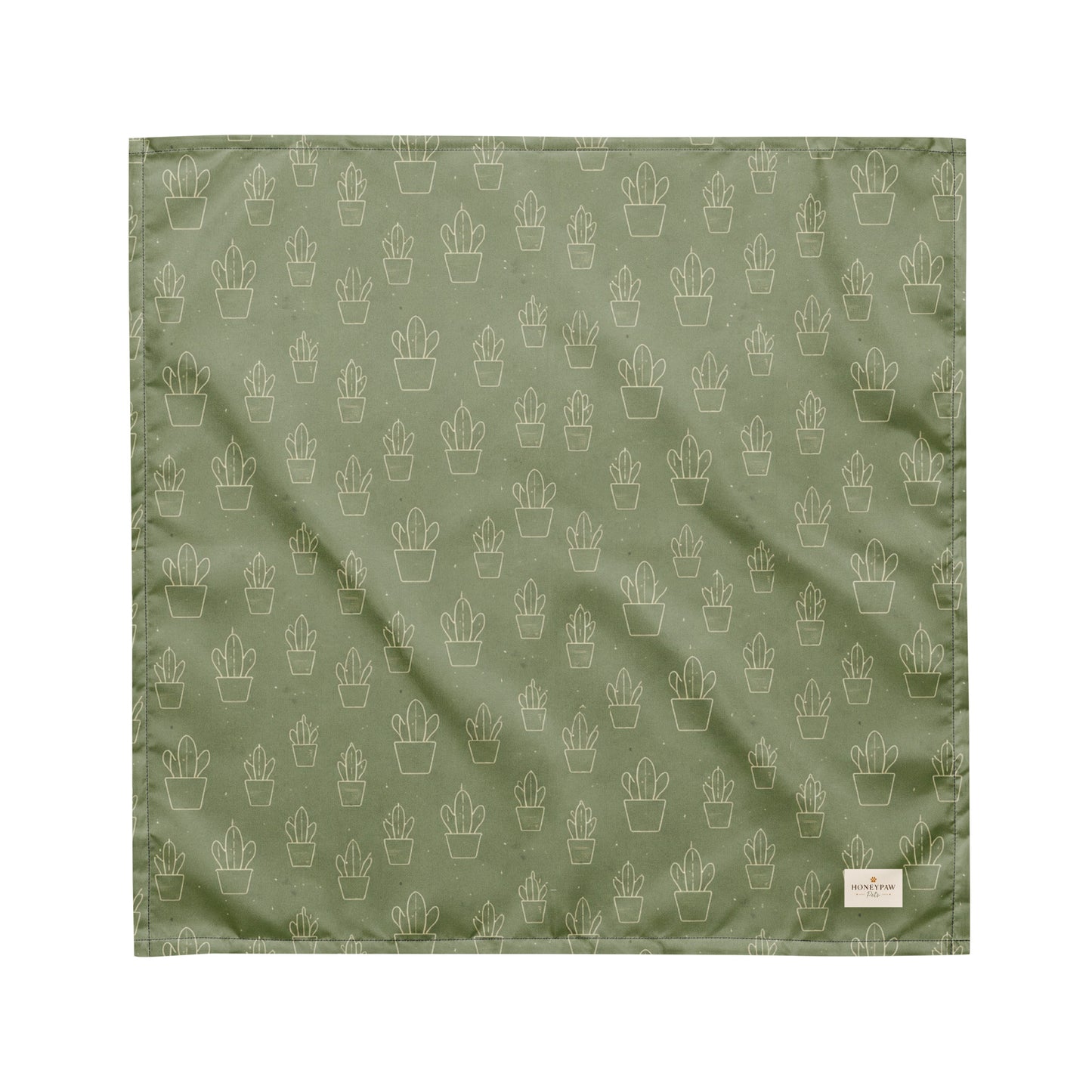 Cactus Cruise dog bandana featuring a sage green background with an all-over cactus pattern by HoneyPaw Pets.