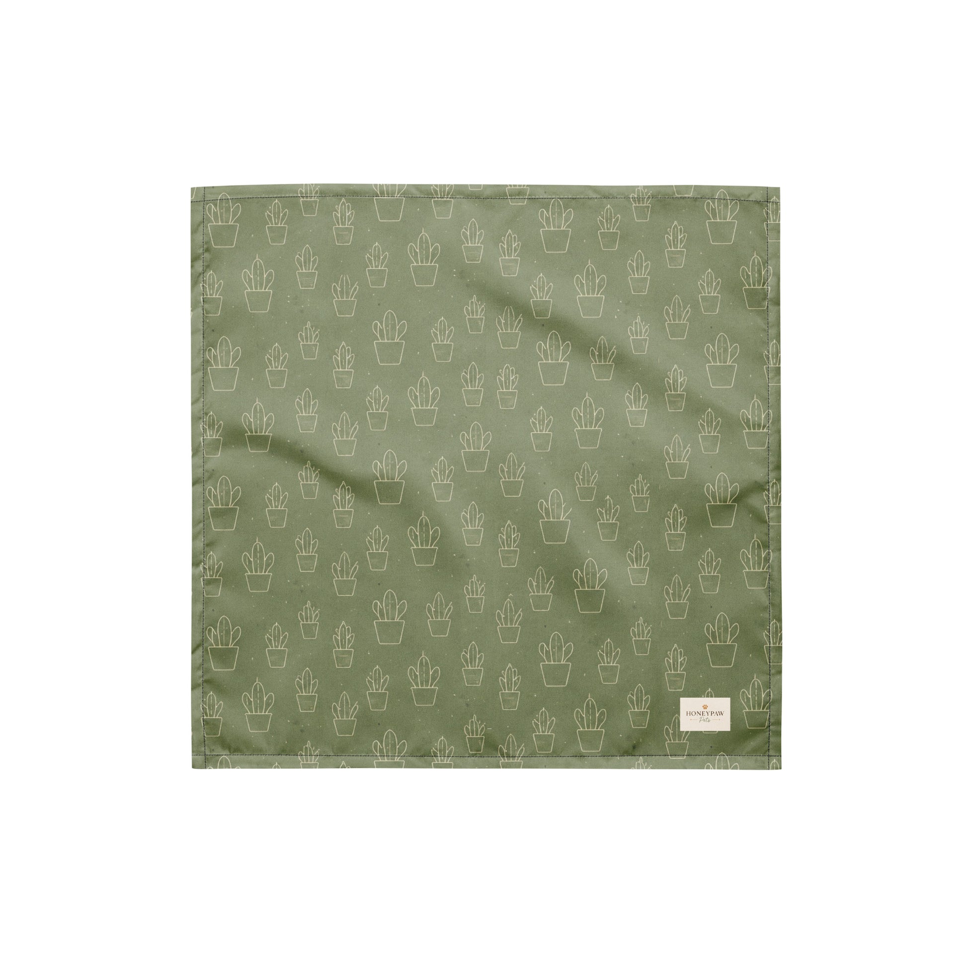 Cactus Cruise dog bandana featuring a sage green background with an all-over cactus pattern by HoneyPaw Pets.