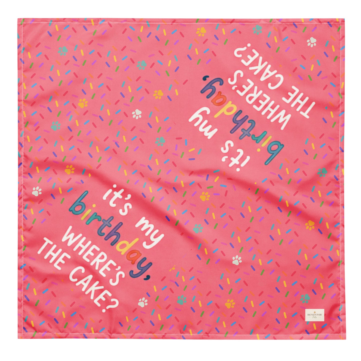 Cake Day Crew birthday dog bandana featuring colorful confetti, paw prints, and the phrase "It's My Birthday, Where's the Cake?" on a bright pink background by HoneyPaw Pets