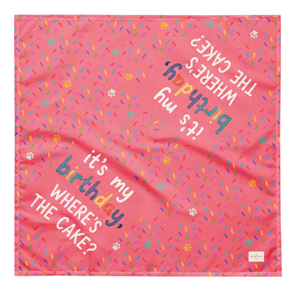 Cake Day Crew birthday dog bandana featuring colorful confetti, paw prints, and the phrase "It's My Birthday, Where's the Cake?" on a bright pink background by HoneyPaw Pets