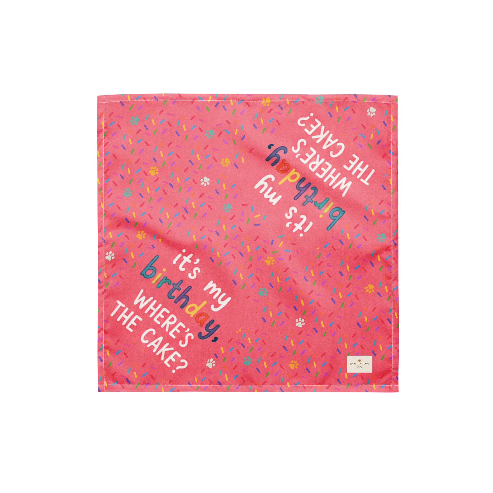 Cake Day Crew birthday dog bandana featuring colorful confetti, paw prints, and the phrase "It's My Birthday, Where's the Cake?" on a bright pink background by HoneyPaw Pets