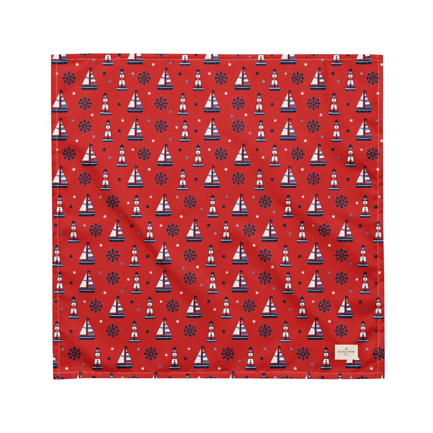 Captain's Companion dog bandana featuring a nautical sailboat and lighthouse pattern on a red background by HoneyPaw Pets.