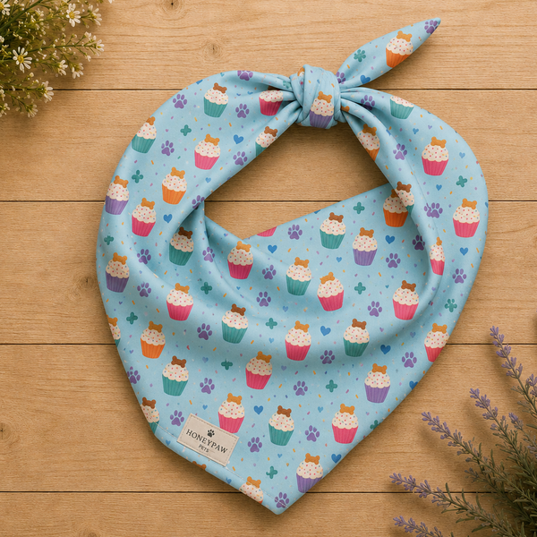Cookie on Top birthday dog bandana featuring colorful cupcakes, hearts and paw prints on a light blue background by HoneyPaw Pets