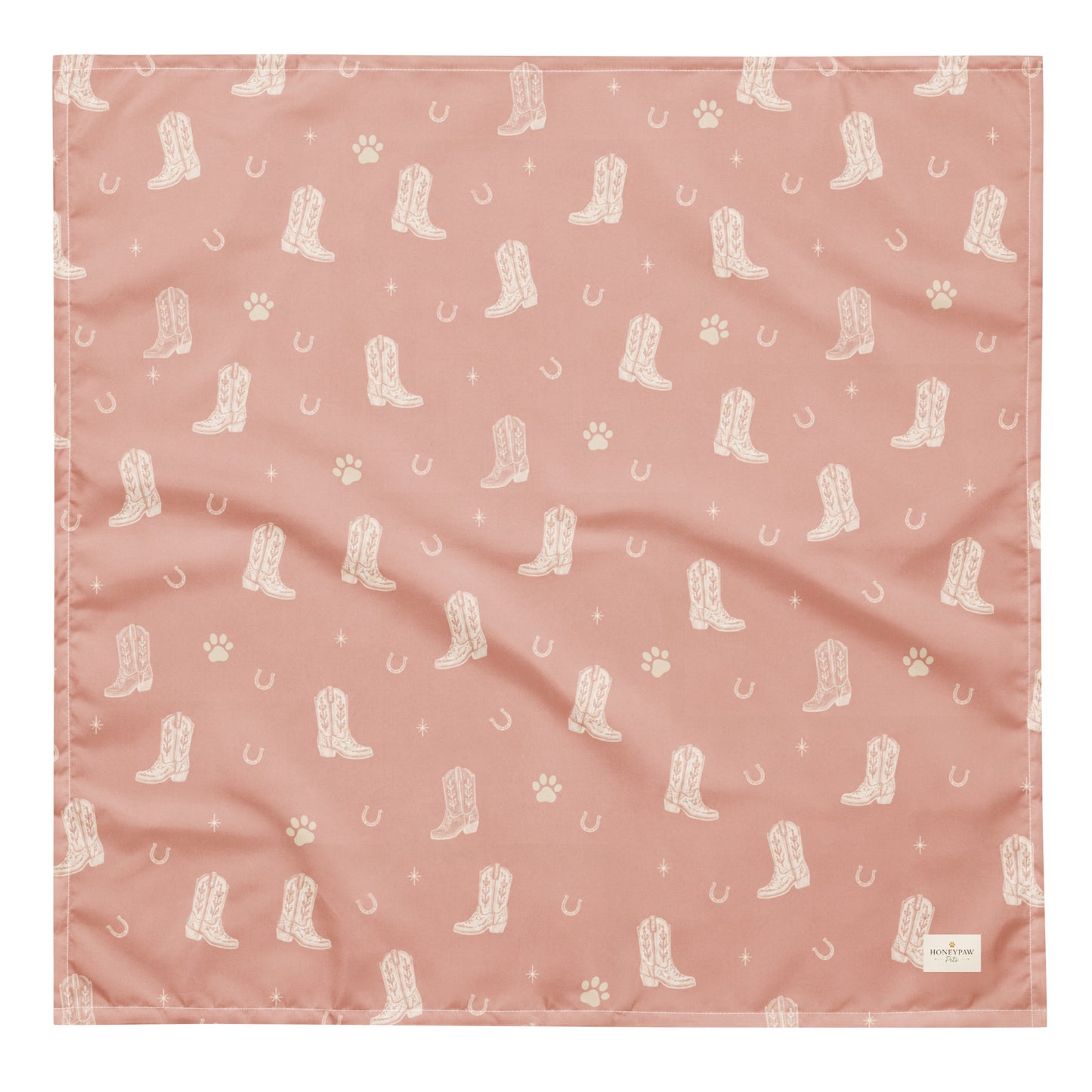 Country Pup western dog bandana featuring western cowboy boots, horseshoes, and paw prints on a blush pink background by HoneyPaw Pets.