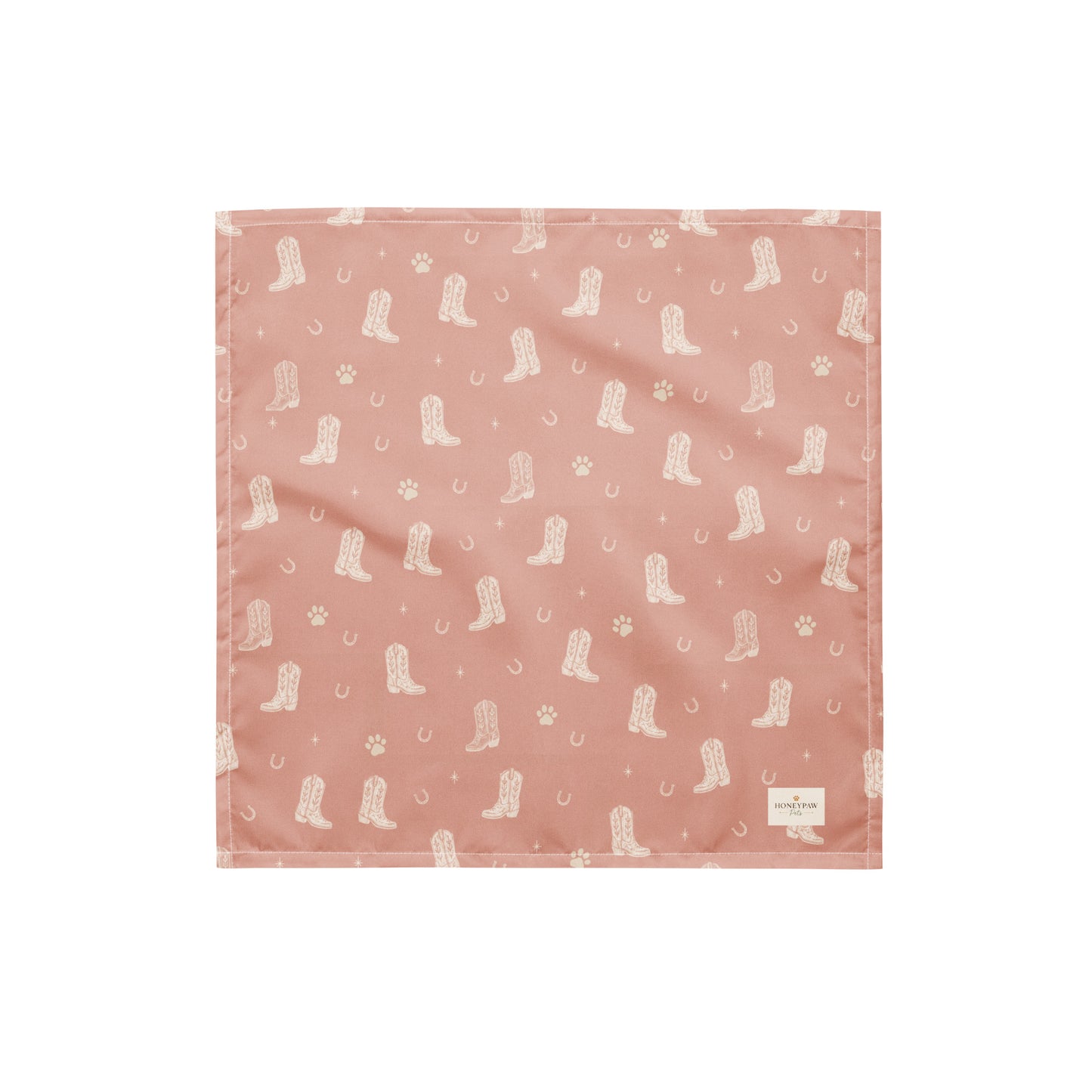 Country Pup western dog bandana featuring western cowboy boots, horseshoes, and paw prints on a blush pink background by HoneyPaw Pets.