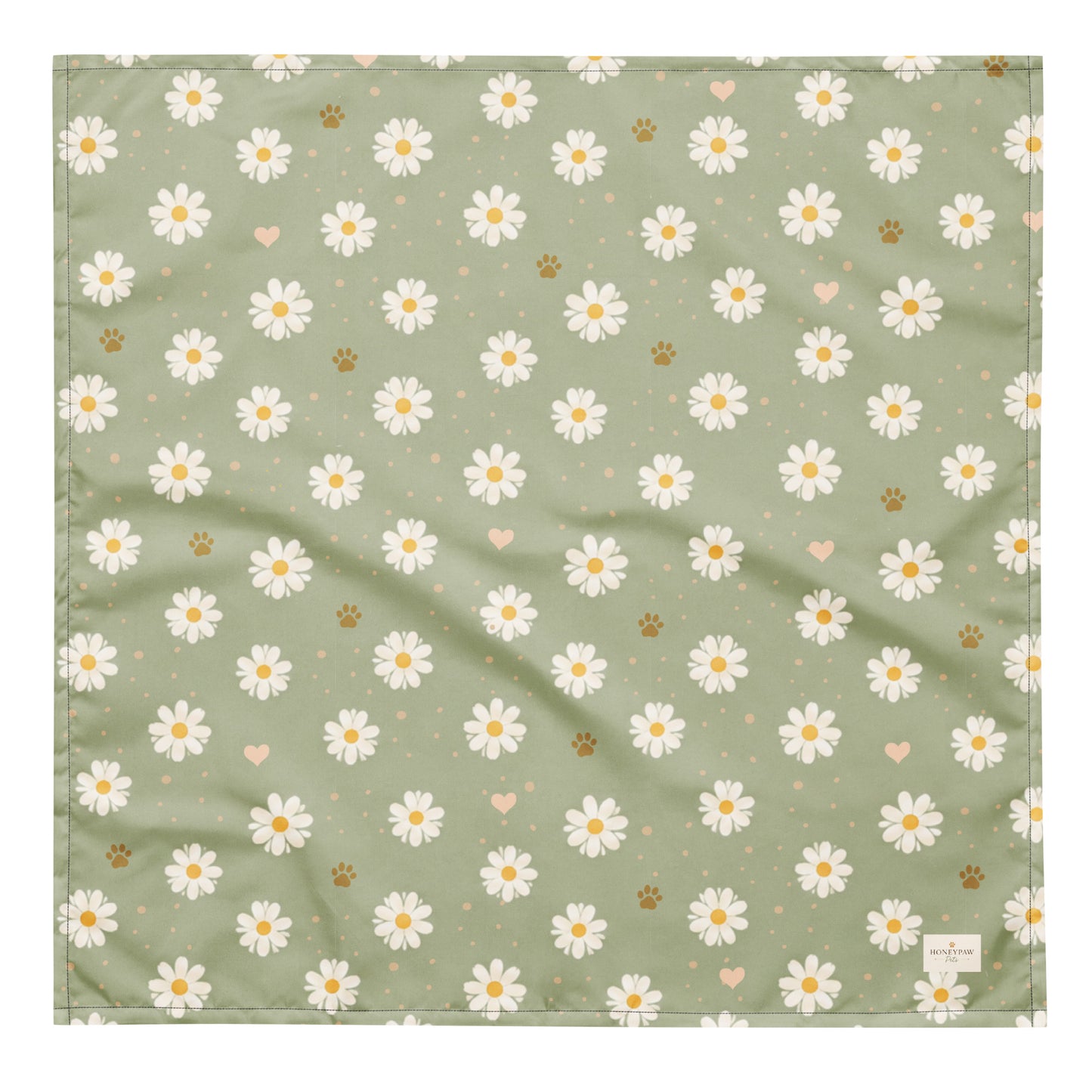 Daisy Dream dog bandana featuring white daisy flowers, golden paw prints, and tiny hearts on a soft sage green background by HoneyPaw Pets.