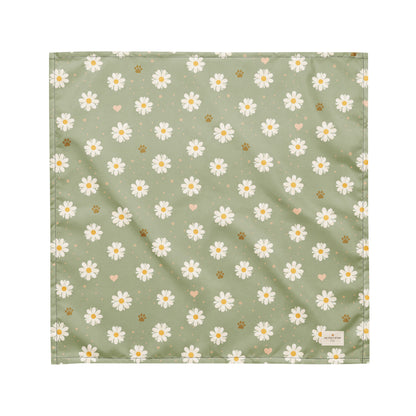 Daisy Dream dog bandana featuring white daisy flowers, golden paw prints, and tiny hearts on a soft sage green background by HoneyPaw Pets.