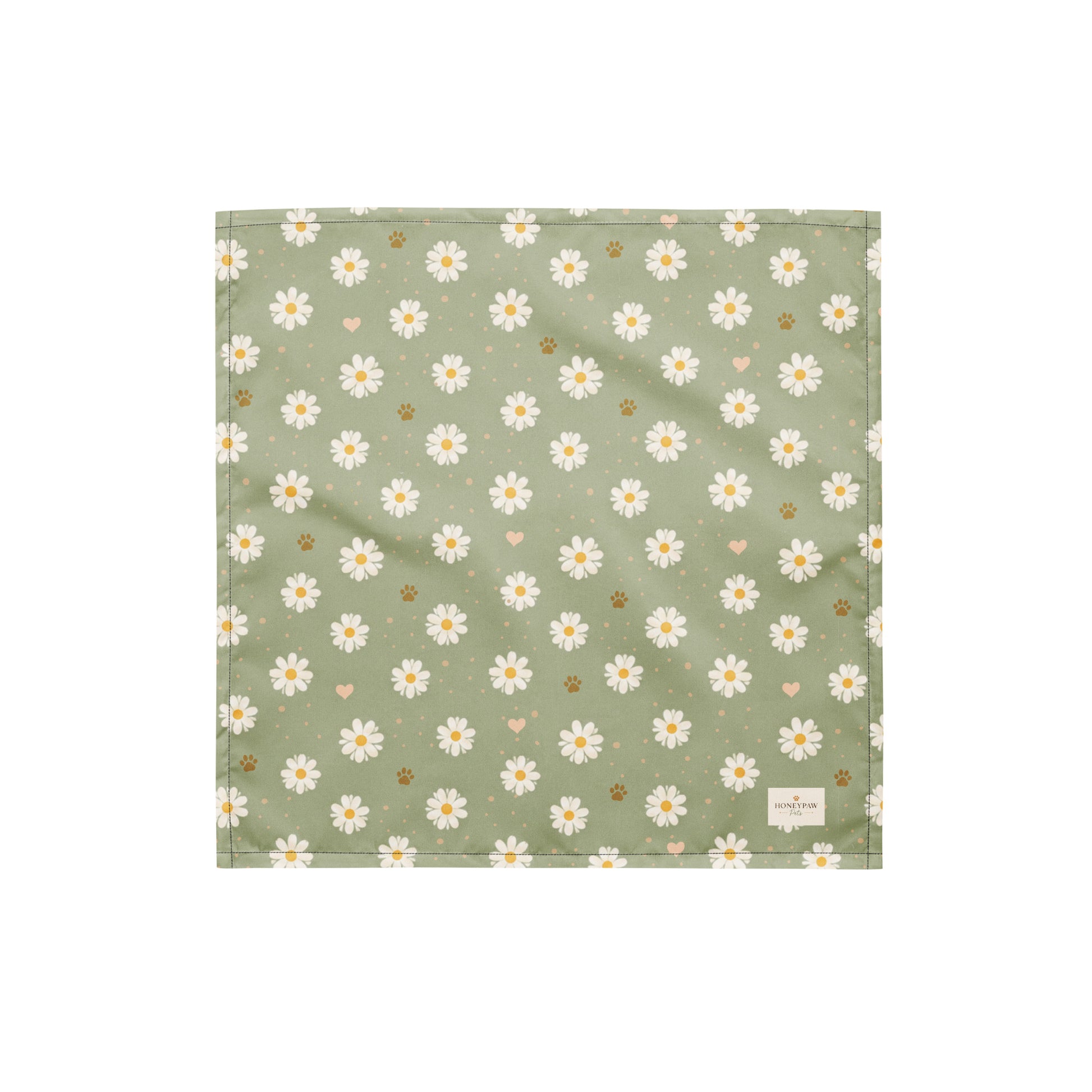 Daisy Dream dog bandana featuring white daisy flowers, golden paw prints, and tiny hearts on a soft sage green background by HoneyPaw Pets.
