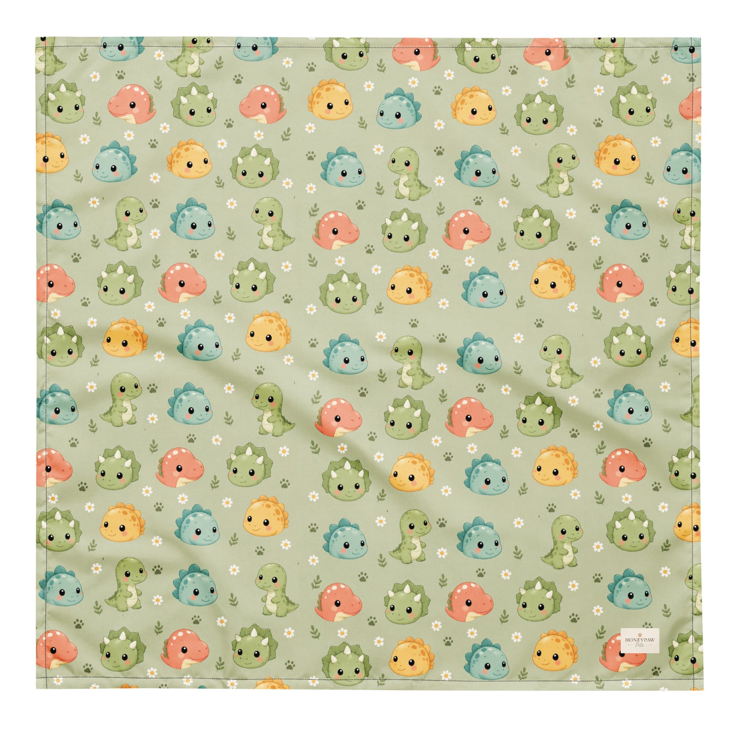 Dino Days dog bandana featuring colorful dinosaur faces and paw prints on a sage green background by HoneyPaw Pets