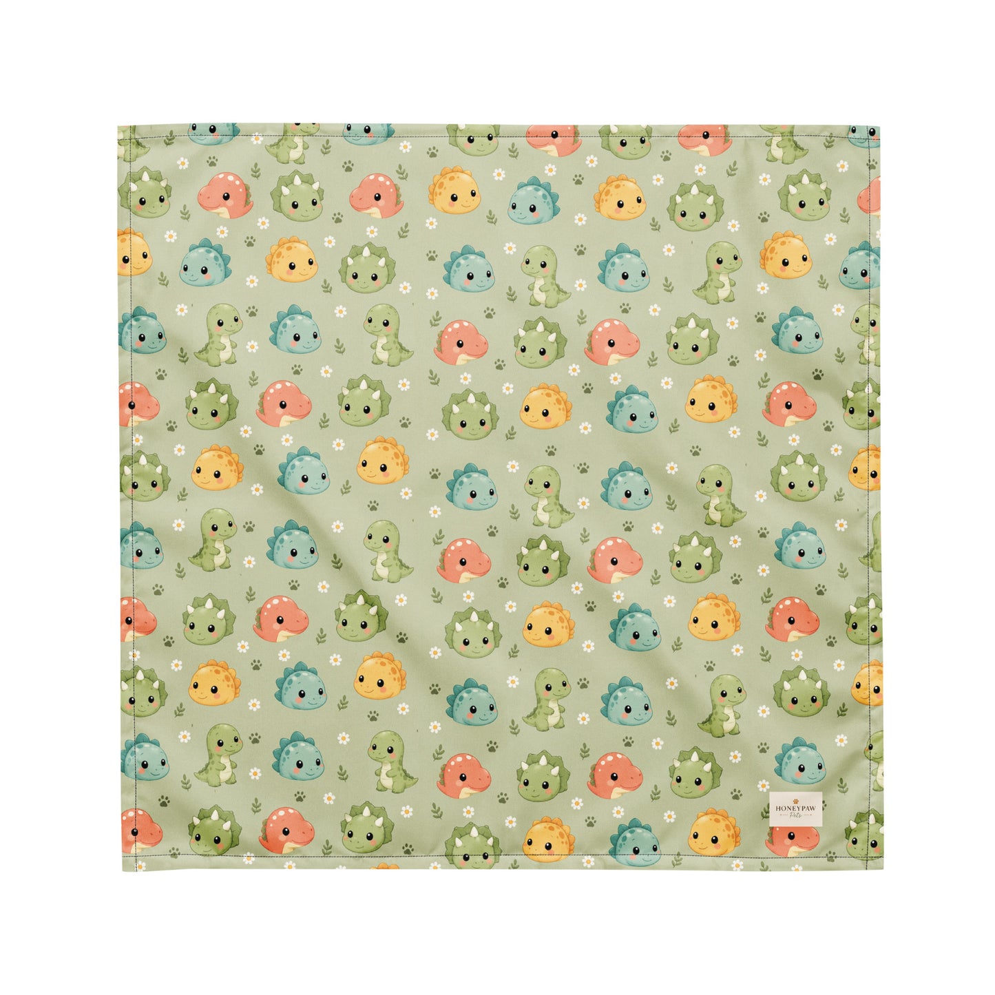 Dino Days dog bandana featuring colorful dinosaur faces and paw prints on a sage green background by HoneyPaw Pets