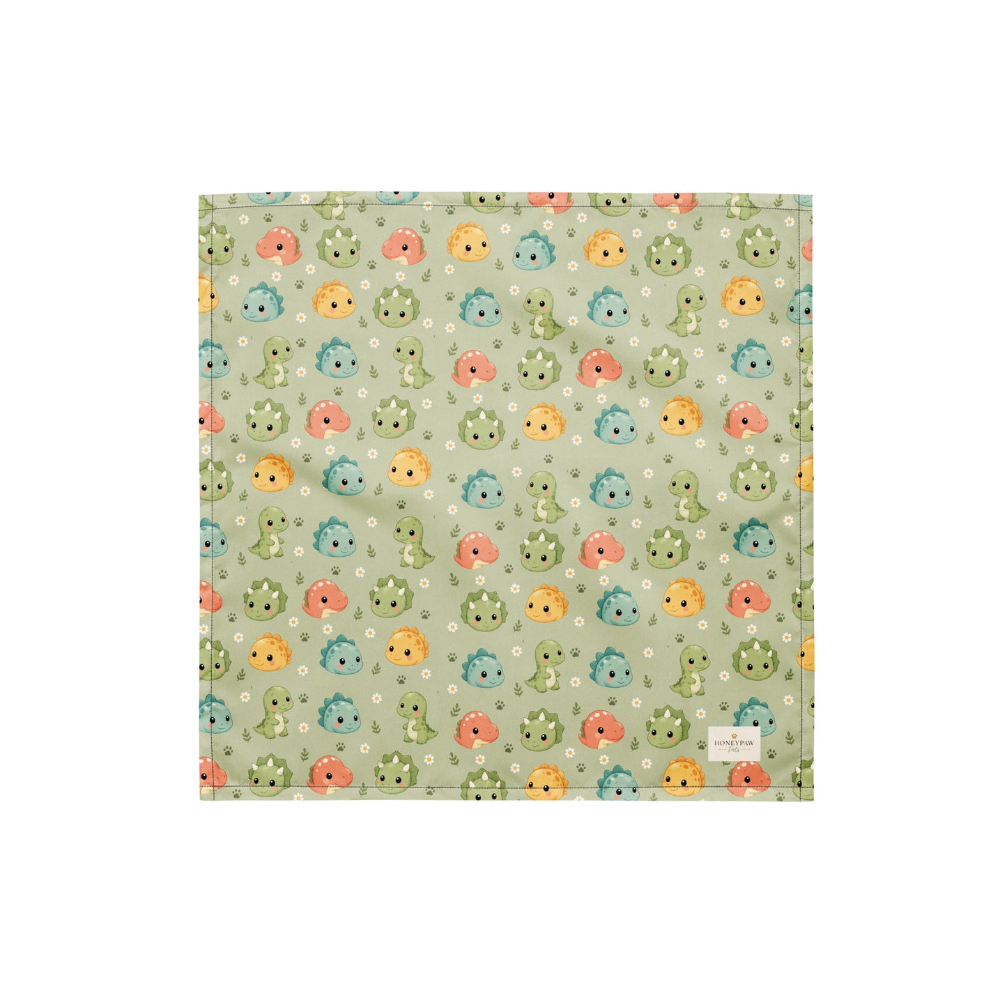 Dino Days dog bandana featuring colorful dinosaur faces and paw prints on a sage green background by HoneyPaw Pets