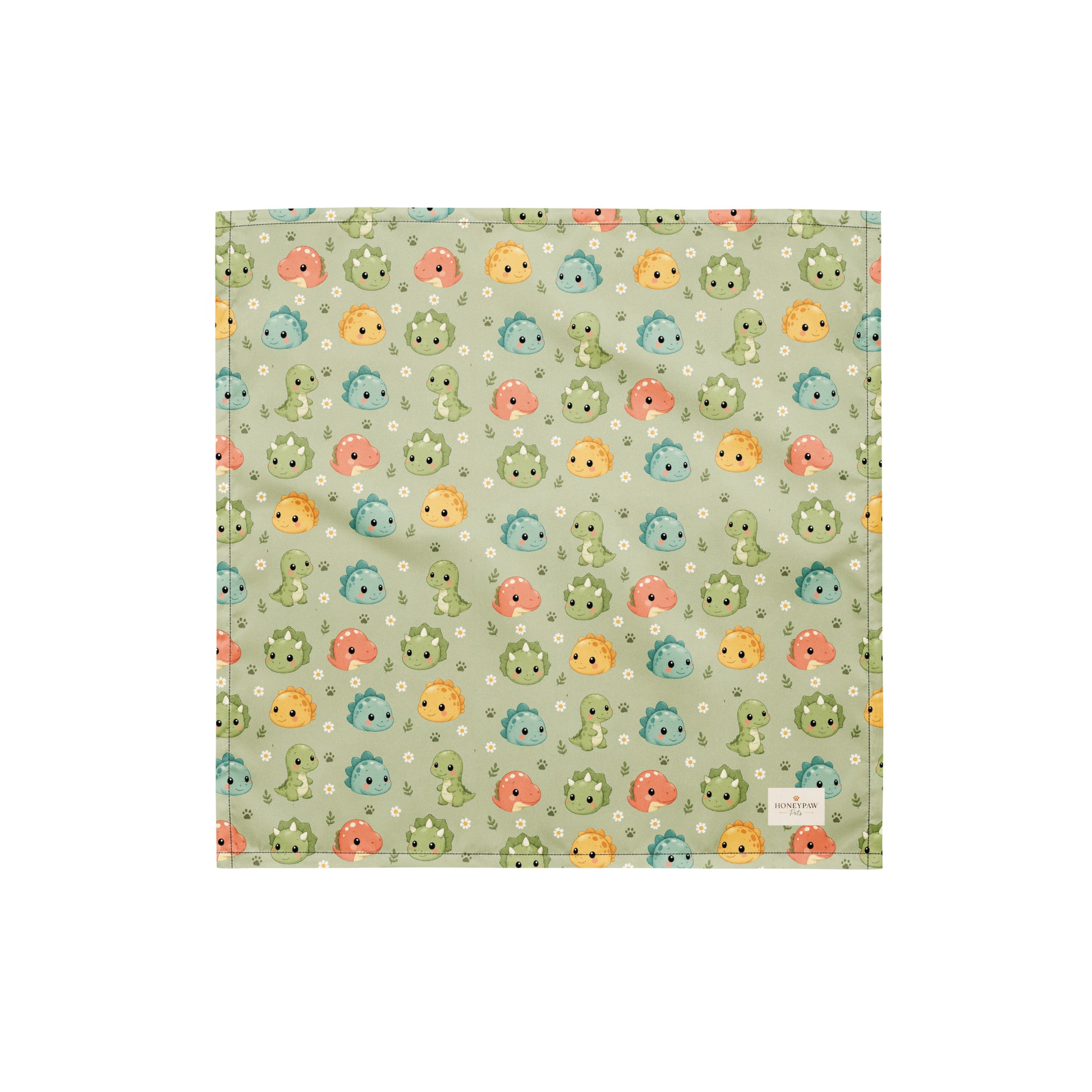 Dino Days dog bandana featuring colorful dinosaur faces and paw prints on a sage green background by HoneyPaw Pets