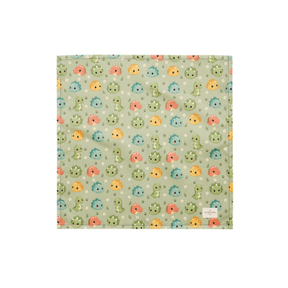 Dino Days dog bandana featuring colorful dinosaur faces and paw prints on a sage green background by HoneyPaw Pets