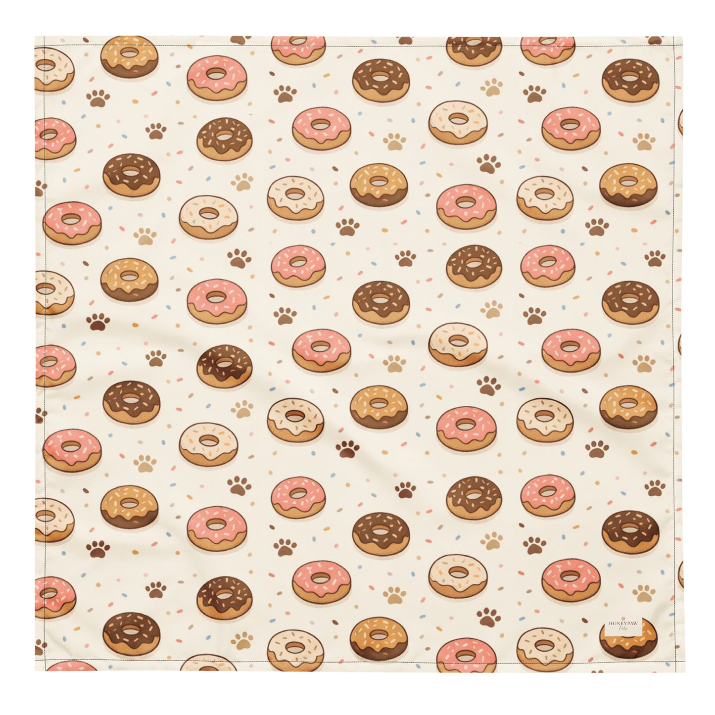 Donut Daydream dog bandana featuring pink and chocolate frosted donuts with paw prints on a cream background by HoneyPaw Pets.