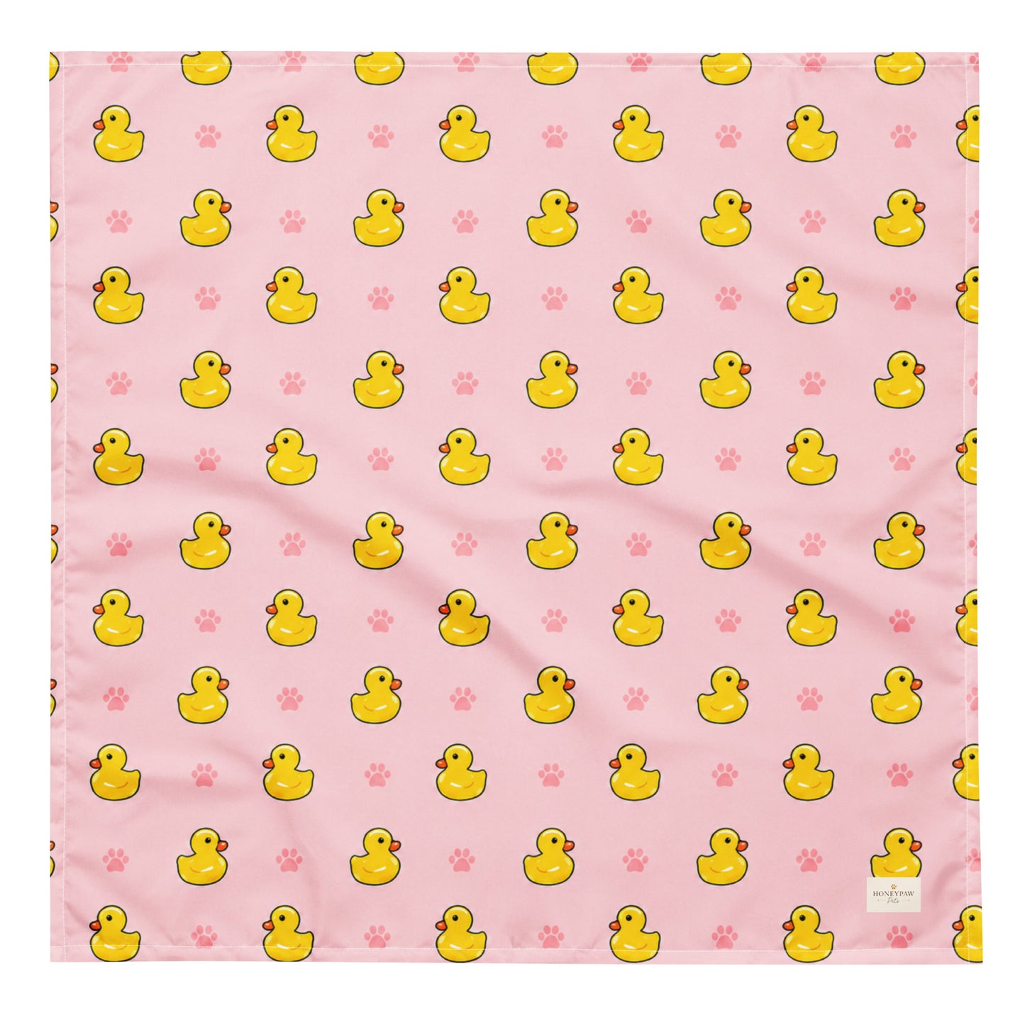 Duckie Dreams dog bandana featuring rubber ducks and paw prints on a pink background by HoneyPaw Pets