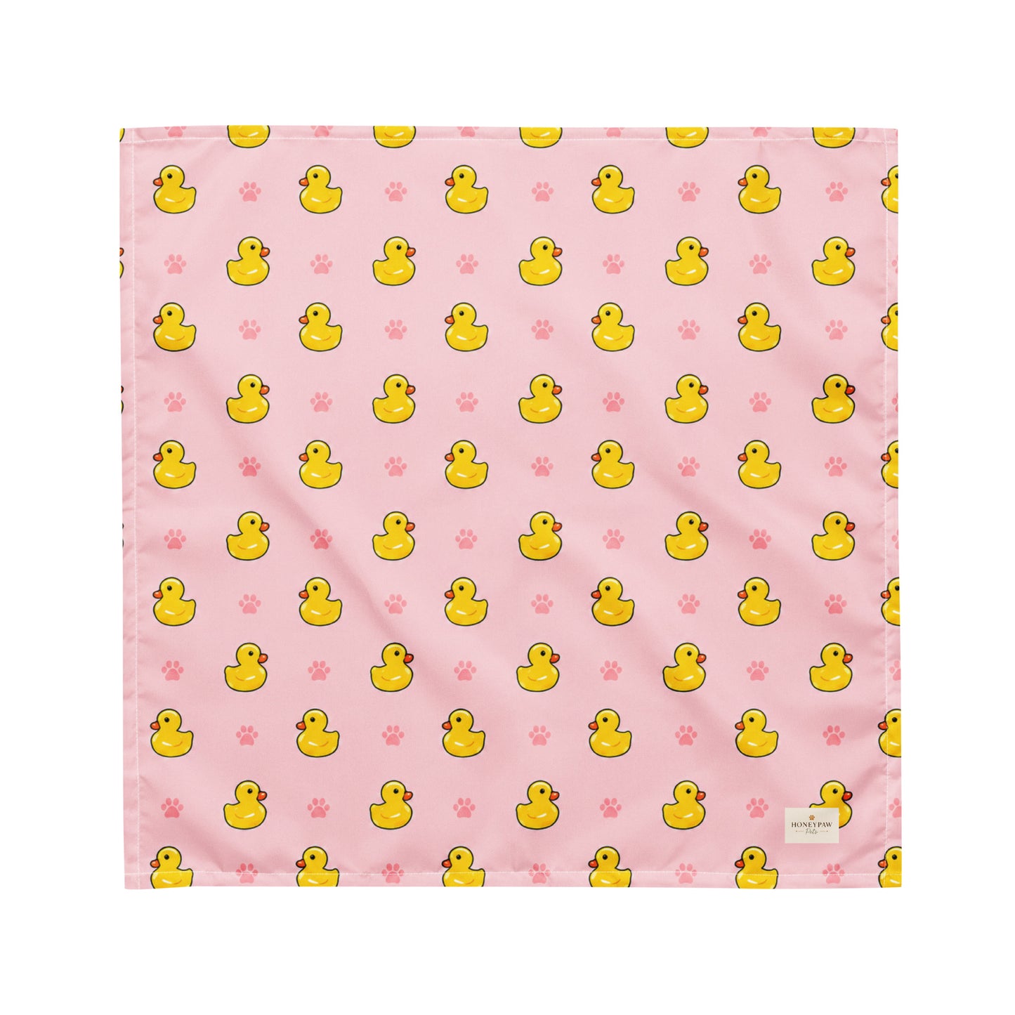 Duckie Dreams dog bandana featuring rubber ducks and paw prints on a pink background by HoneyPaw Pets