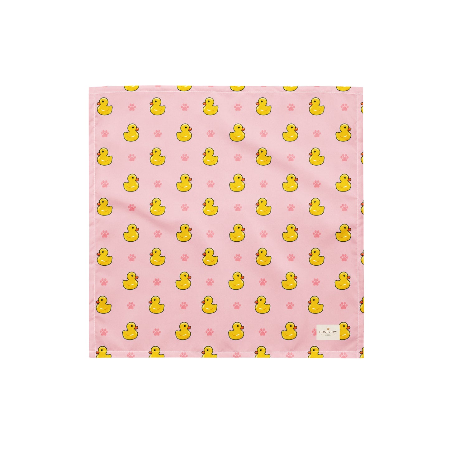 Duckie Dreams dog bandana featuring rubber ducks and paw prints on a pink background by HoneyPaw Pets