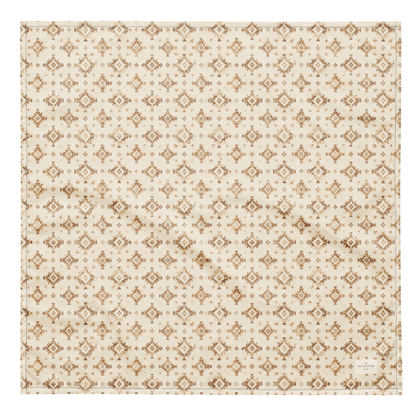 Dusty Paws dog bandana featuring a cream background with a western-inspired geometric pattern in warm tan tones by HoneyPaw Pets.