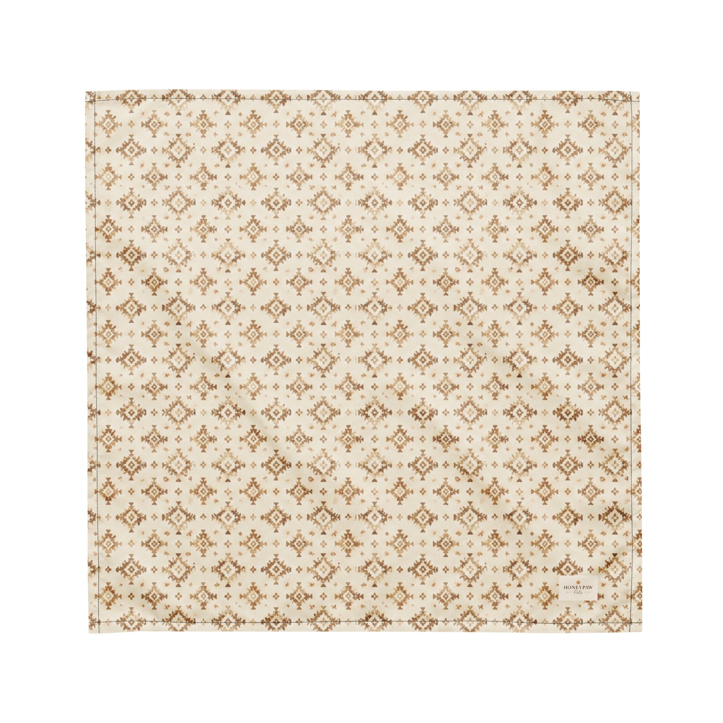 Dusty Paws dog bandana featuring a cream background with a western-inspired geometric pattern in warm tan tones by HoneyPaw Pets.