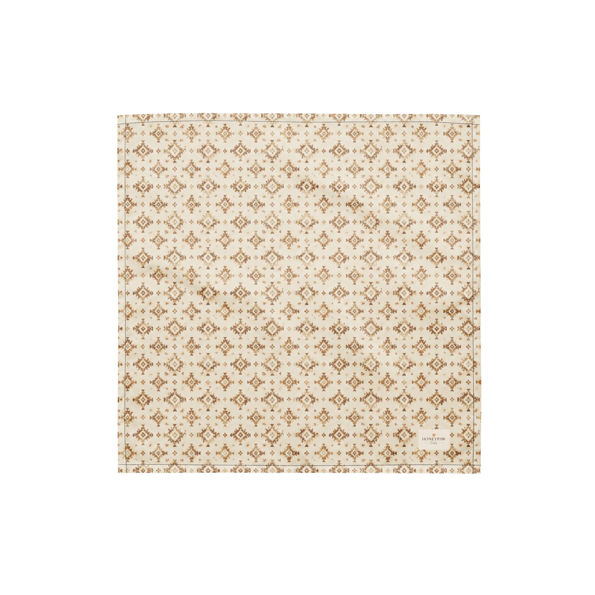 Dusty Paws dog bandana featuring a cream background with a western-inspired geometric pattern in warm tan tones by HoneyPaw Pets.