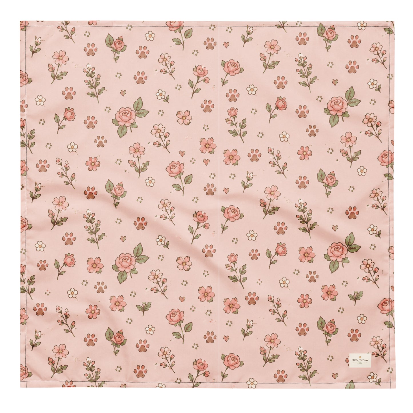Feeling Rosy dog bandana featuring a blush pink background with delicate rose floral prints and paw print accents by HoneyPaw Pets.