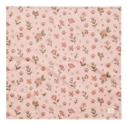 Feeling Rosy dog bandana featuring a blush pink background with delicate rose floral prints and paw print accents by HoneyPaw Pets.