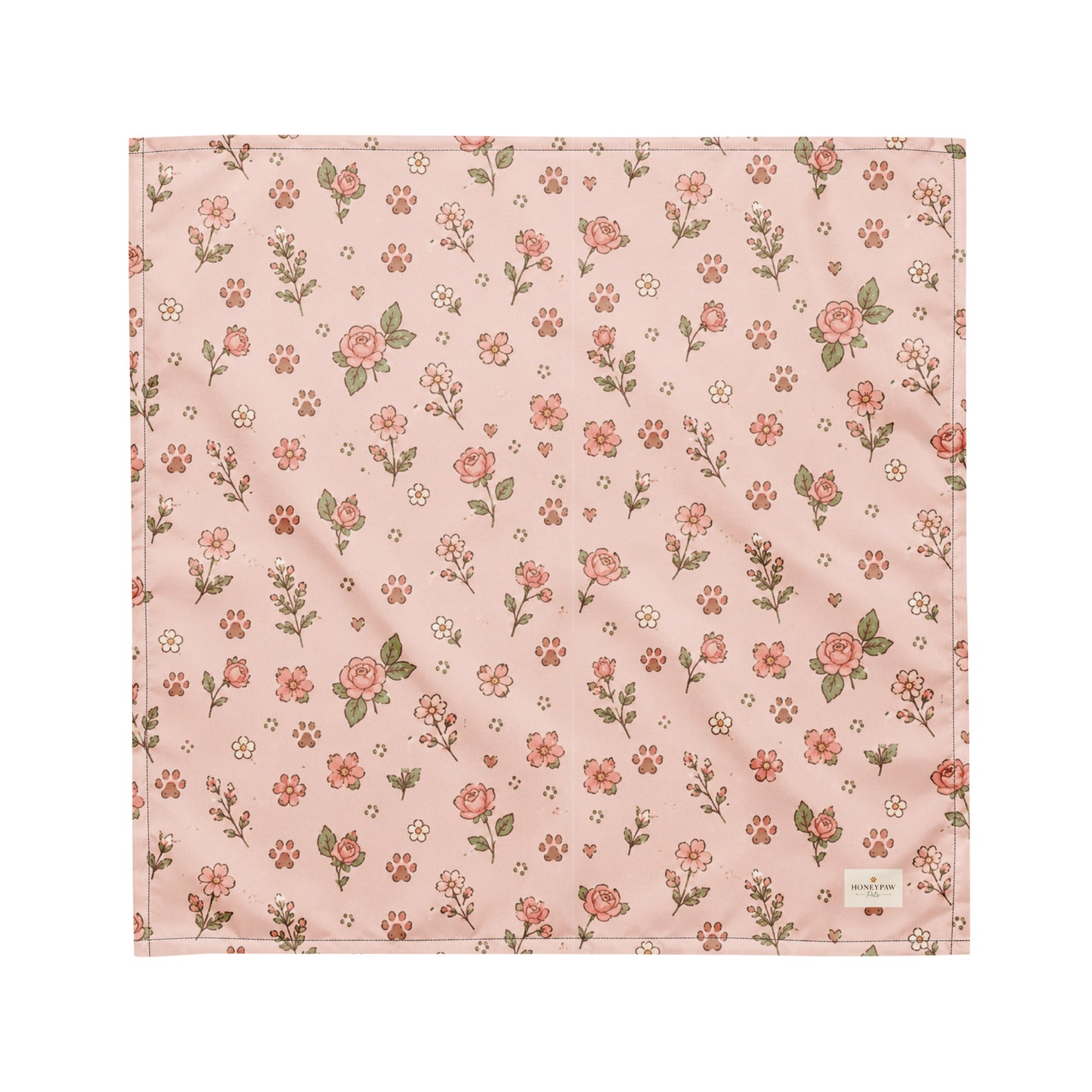 Feeling Rosy dog bandana featuring a blush pink background with delicate rose floral prints and paw print accents by HoneyPaw Pets.