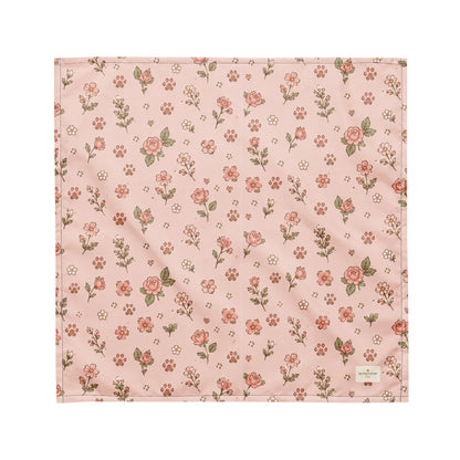 Feeling Rosy dog bandana featuring a blush pink background with delicate rose floral prints and paw print accents by HoneyPaw Pets.