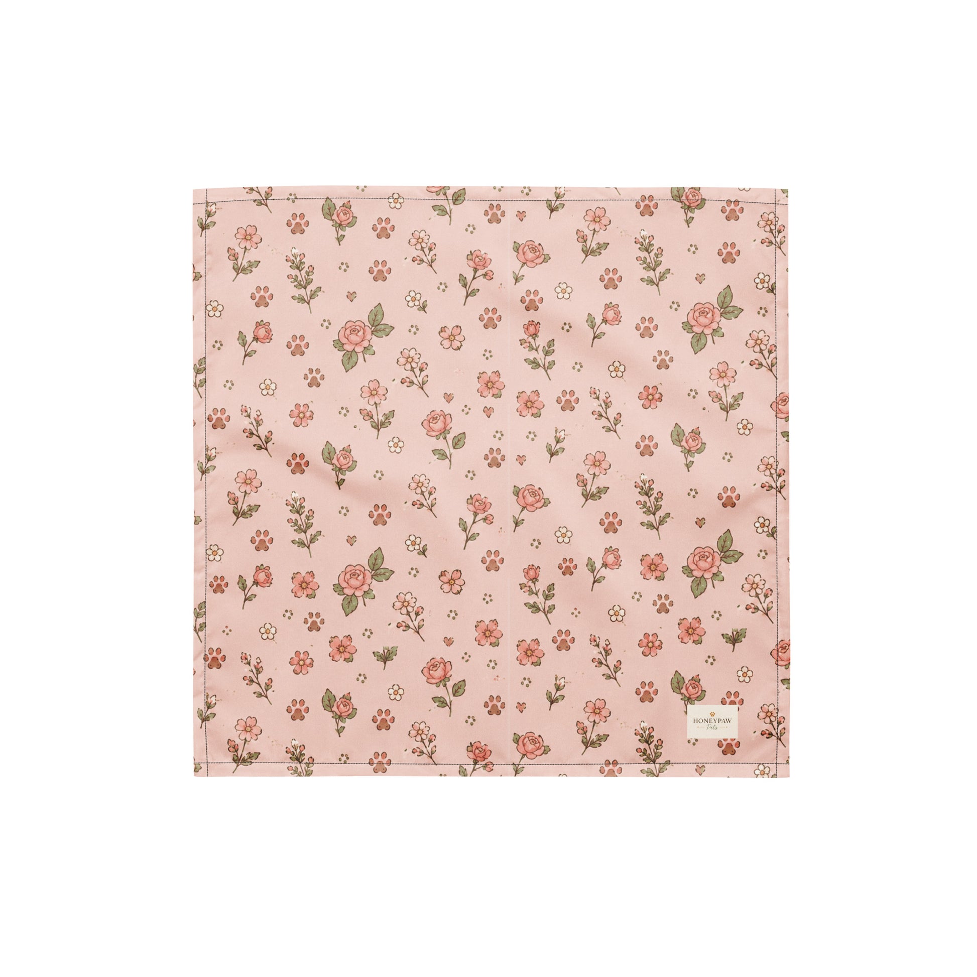 Feeling Rosy dog bandana featuring a blush pink background with delicate rose floral prints and paw print accents by HoneyPaw Pets.