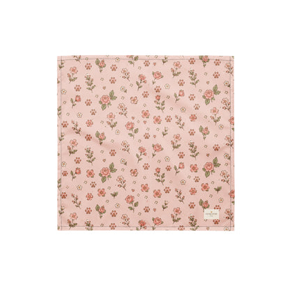 Feeling Rosy dog bandana featuring a blush pink background with delicate rose floral prints and paw print accents by HoneyPaw Pets.