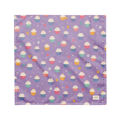 Frosted Paws dog bandana featuring colorful cupcakes, paw prints, and stars on a lavender purple background by HoneyPaw Pets