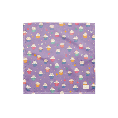 Frosted Paws dog bandana featuring colorful cupcakes, paw prints, and stars on a lavender purple background by HoneyPaw Pets