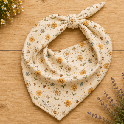Honey Bloom dog bandana featuring a cream floral pattern in honey gold and soft sage by HoneyPaw Pets.