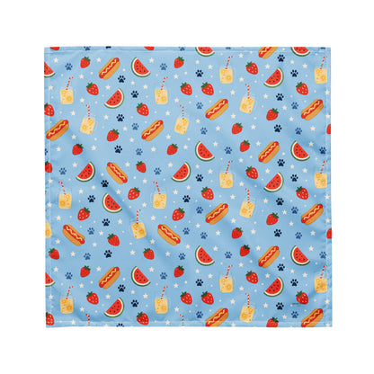 Hot Dog dog bandana featuring a summer picnic pattern with hot dogs, watermelon, and strawberries on a light blue background by HoneyPaw Pets.