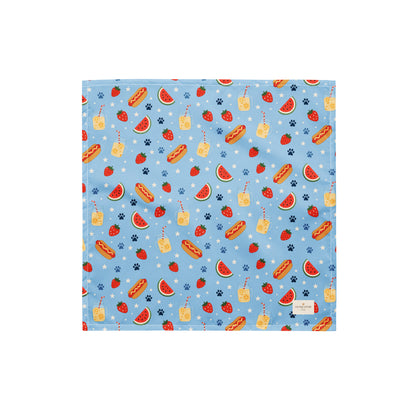 Hot Dog dog bandana featuring a summer picnic pattern with hot dogs, watermelon, and strawberries on a light blue background by HoneyPaw Pets.