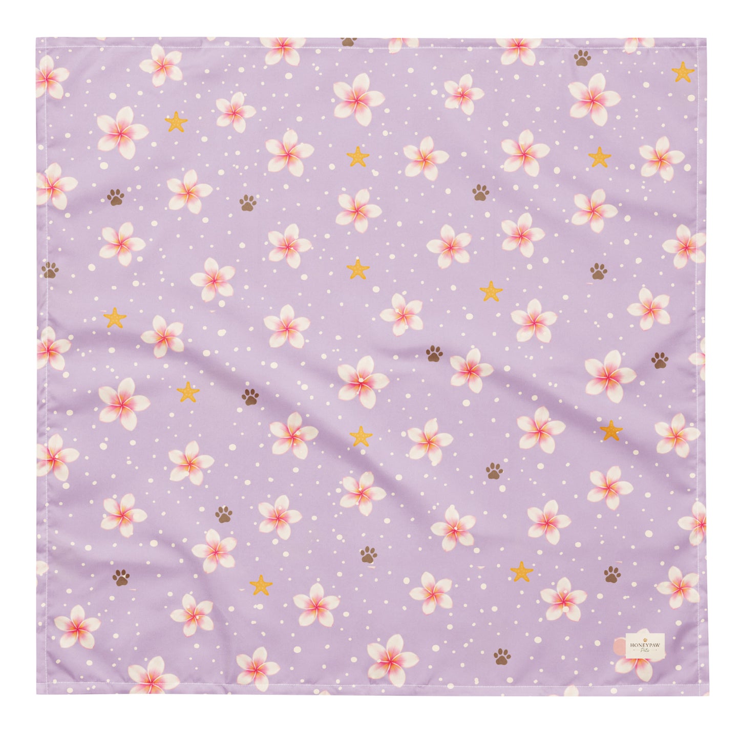 Island Scent dog bandana featuring pink plumeria flowers, paw prints, and golden stars on a lavender background by HoneyPaw Pets.