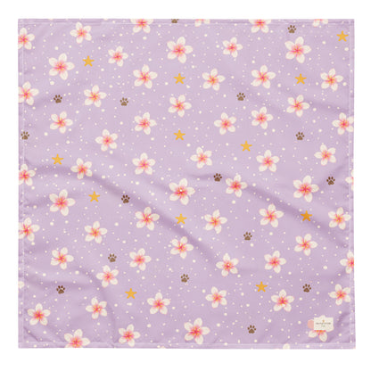 Island Scent dog bandana featuring pink plumeria flowers, paw prints, and golden stars on a lavender background by HoneyPaw Pets.