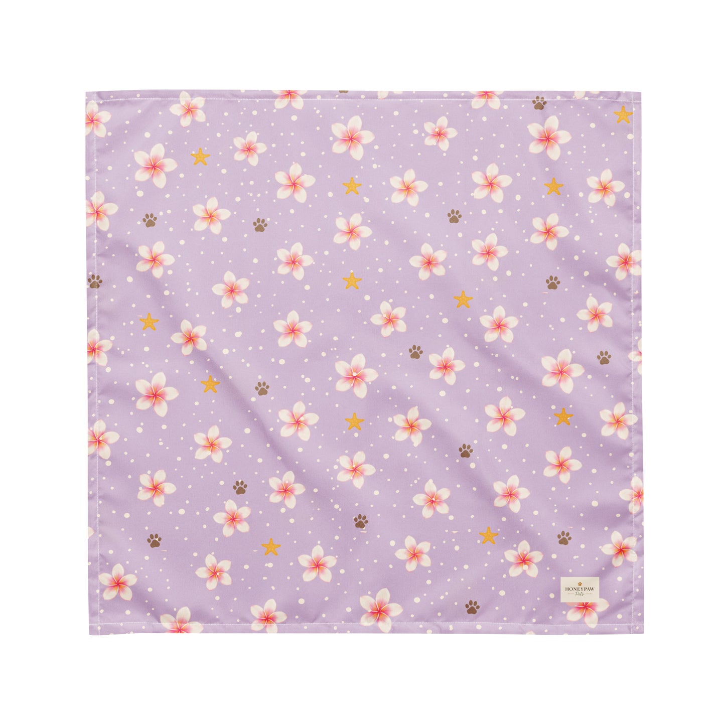 Island Scent dog bandana featuring pink plumeria flowers, paw prints, and golden stars on a lavender background by HoneyPaw Pets.