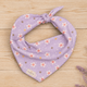 Island Scent dog bandana featuring pink plumeria flowers, paw prints, and golden stars on a lavender background by HoneyPaw Pets.