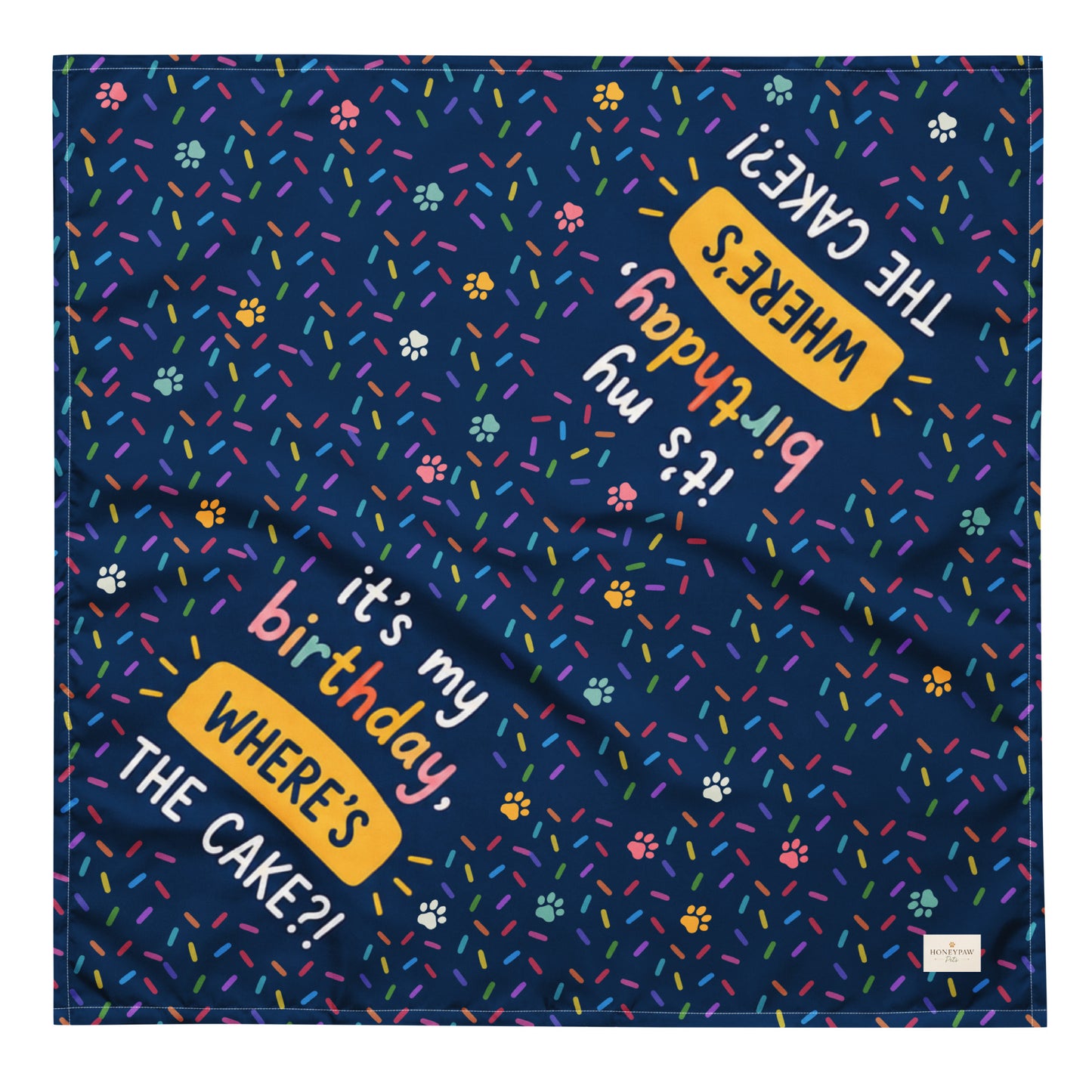It's My Birthday birthday dog bandana featuring colorful confetti, paw prints, and the phrase "It's My Birthday, Where's the Cake?" on a navy blue background by HoneyPaw Pets