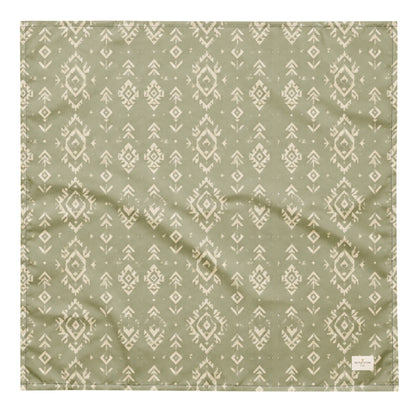 Juniper Trail dog bandana featuring a sage green background with a western-inspired geometric pattern in soft cream tones by HoneyPaw Pets.