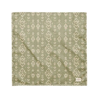 Juniper Trail dog bandana featuring a sage green background with a western-inspired geometric pattern in soft cream tones by HoneyPaw Pets.